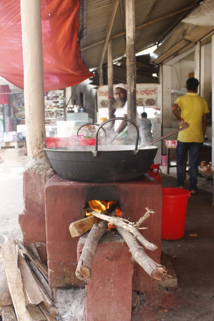 A steaming pot is sitting on top of a Bondhu chula stove.