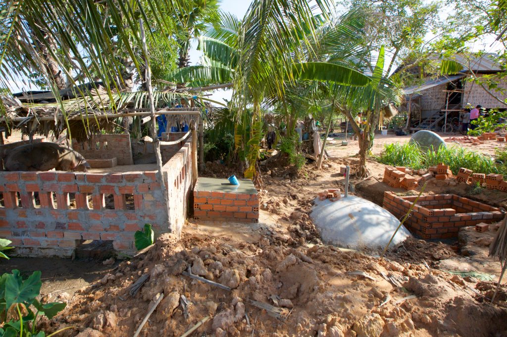 A biogas digester construction side is seen in a Cambodian village