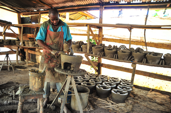 A Kenyan man produces improved cookstoves out of clay.